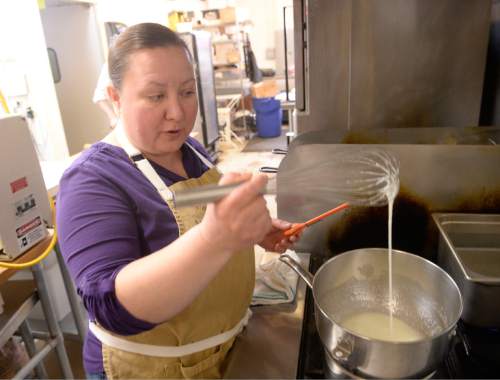 Al Hartmann  |  The Salt Lake Tribune
Salt Lake City pastry chef Romina Rasmussen, owner of Les Madeleines Bakery in Salt Lake City, begins the meringue with egg whites and sugar in a double boiler.  The mixture is gently beaten with a whisk as it comes up to temperature and starts to thicken.