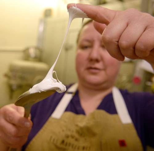 Al Hartmann  |  The Salt Lake Tribune
Salt Lake City pastry chef Romina Rasmussen, owner of Les Madeleines Bakery in Salt Lake City, tests the consistency of the finished meringue. It's thick, silky and stands into peaks.