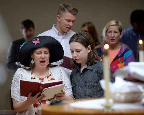 Al Hartmann  |  The Salt Lake Tribune 
Members of the Mount Tabor Lutheran Church sing gathering hymn that "Christ is risen" at Easter service Sunday March 27 in Salt Lake City.
