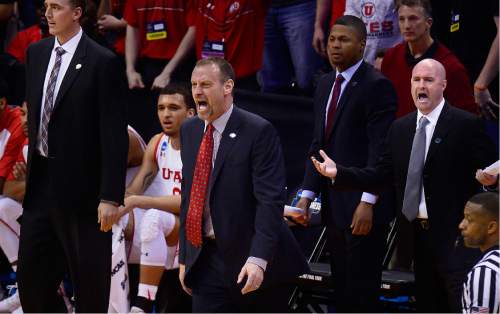 Scott Sommerdorf   |  The Salt Lake Tribune  
Utah head coach Larry Krystkowiak and assistants yell at officials questioning a call during first half play. Gonzaga held a 44-29 lead over Utah at the half, Saturday, March 19, 2016.