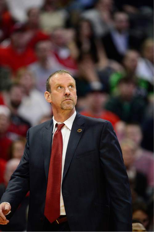 Scott Sommerdorf   |  The Salt Lake Tribune  
Utah Utes head coach Larry Krystkowiak glances at the scoreboard late in the second half after Utah took back the momentum and the lead. Utah beat Fresno State 80-69 in Denver, Thursday, March 17, 2016.