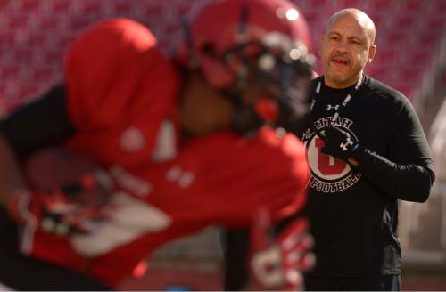 Leah Hogsten  |  The Salt Lake Tribune
Guy Holliday, University of Utah football receivers coach, runs through drills with players Saturday, March 26, 2016 at Rice-Eccles Stadium. Holliday, 50, is the only newcomer to Utah's football coaching staff this year and takes over a unit with less proven talent and experience as the Utes lose their top three receiving yard leaders and replace quarterback Travis Wilson.