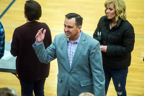 Chris Detrick  |  The Salt Lake Tribune
Speaker of the House Gregory H. Hughes (R-Draper) talks to voters in precinct 13 during the Republican caucus at Corner Canyon High School Tuesday March 22, 2016.
