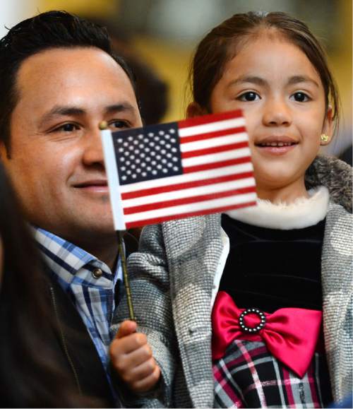 Steve Griffin  |  The Salt Lake Tribune


New US citizen Ruben Becerra smiles as he holds his daughter Kayla during a naturalization ceremony at the State Capitol Rotunda in Salt Lake City, Monday, March 28, 2016. Becarra was joined by 142 people from 51 counties who became new citizens during the special ceremony.