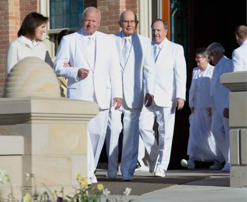 Leah Hogsten  |  The Salt Lake Tribune
l-r Marsha and Elder Kent F. Richards of The Church of Jesus Christ of Latter-Day Saints,  Elder Dallin H. Oaks of the Quorum of the Twelve Apostles, Elder Lynn G. Robbins of the Seventy and others at the Provo City Center Temple cornerstone ceremony. The Provo City Center Temple was dedicated Sunday, March 20, 2016. The Church's 112-year-old Provo Tabernacle burned in December 2010 and only the shell of the building was left. After the burned-out structure was gutted, Mormon leaders decided to use the building's exterior to house the temple.