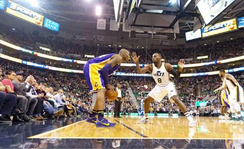Lennie Mahler  |  The Salt Lake Tribune

Kobe Bryant is guarded by Shelvin Mack during his last game at Vivint Smart Home Arena facing the Utah Jazz in Salt Lake City, Monday, March 28, 2016.
