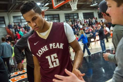 Chris Detrick  |  The Salt Lake Tribune
Lone Peak's Frank Jackson (15) leaves the court after the game at Wasatch Academy Thursday December 10, 2015.  Lone Peak won the game 68-65.