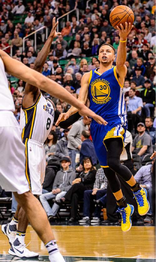 Trent Nelson  |  The Salt Lake Tribune
Golden State Warriors guard Stephen Curry (30) puts up a shot as the Utah Jazz host the Golden State Warriors in Salt Lake City, Wednesday March 30, 2016.