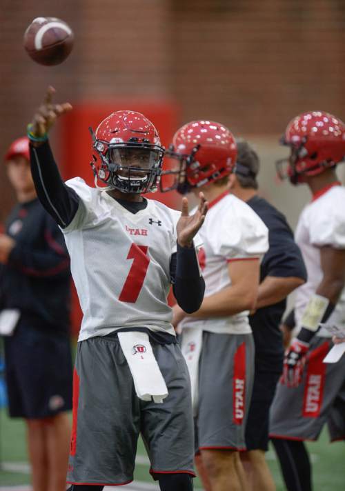 Francisco Kjolseth | The Salt Lake Tribune
Quarter back Tyler Huntley finds his target as the University of Utah football team kicks off opening day of spring practice on Tuesday, March 22, 2016.