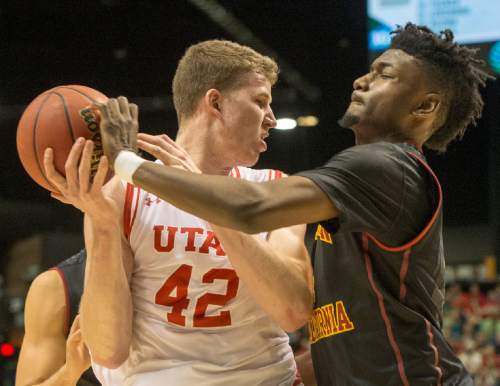 Rick Egan  |  The Salt Lake Tribune

USC Trojans forward Chimezie Metu (4) knocks the ball from out of the hands of Utah Utes forward Jakob Poeltl (42), Metu was a called for a foul on the play, as Utah defeated USC Trojans 80-72, at the MGM Arena, in Las Vegas, Thursday, March 10, 2016.