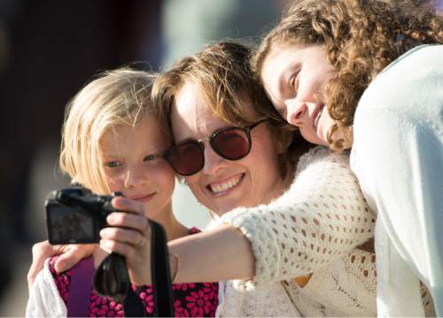 Rick Egan  |  The Salt Lake Tribune
Diana, Tara and Sarah Buck, Provo, take a selfie before the General Women's Session of the 186st Annual LDS General Conference on Saturday.