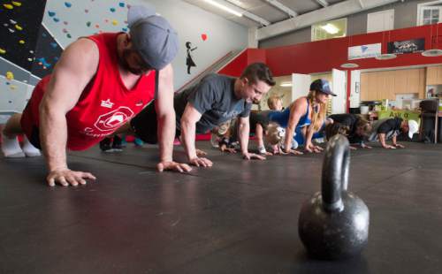 Steve Griffin  |  The Salt Lake Tribune
Gym members so pushups during the fourth annual online drive for nonprofit donations, dubbed Love UT Give UT, at the gym Fit To Recover in Salt Lake City, Thursday, March 31, 2016. The gym, designed for people recovering from drug and alcohol addiction, offered its members and their friends and family the chance to work out for money. Last year, Fit To Recover raised $3,000 through 30,000 burpees, situps, push-ups, etc. Love UT Give UT raised over $1.2 million for nearly 500 charities during its daylong drive in 2015 and hoped to raise $1.6 million in 2016.