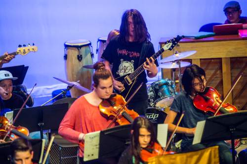Chris Detrick  |  The Salt Lake Tribune
Emil Welker performs 'Kashmir' with other students during their annual pops concert at Salt Lake Arts Academy on Thursday.