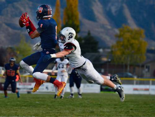 Scott Sommerdorf  |  The Salt Lake Tribune
Brighton WR Simi Fehoko catches this pass during second half play. Brighton beat Syracuse 35-14 in a 5A first-round playoff game at Brighton, Friday, October 31, 2014.