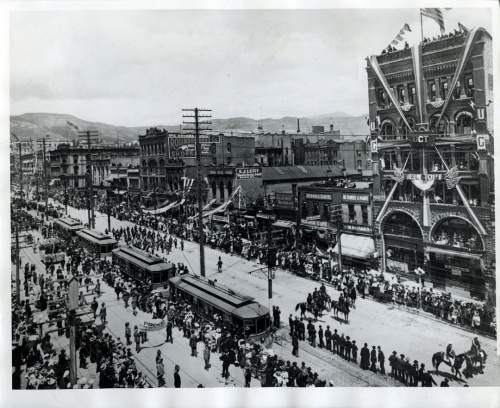 Tribune file photo

Trolley car wait on Main Street during a parade in this undated photo.