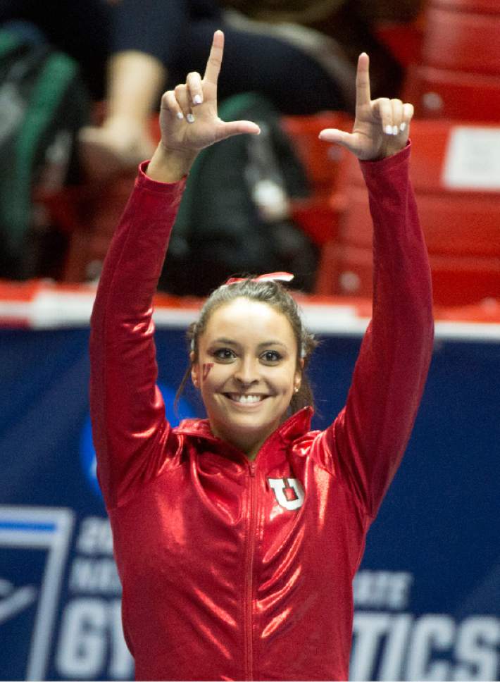 Rick Egan  |  The Salt Lake Tribune

Kailah Delaney salutes the crowd, as they announce that she won the individual title on the vault, in the NCAA Regional Championships, at the Huntsman Center, Saturday, April 2, 2016.