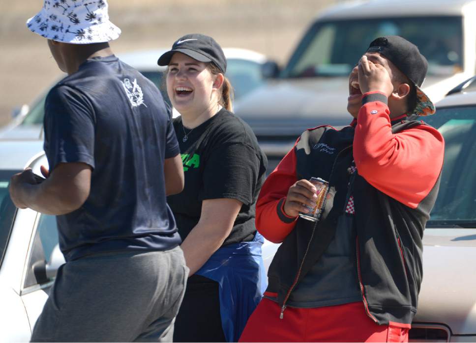 Leah Hogsten  |  The Salt Lake Tribune
l-r Kau Toa Girls Rugby Club supporters Razhan Reed, Courtney Tiatia and B. J. Tiatia enjoy watching their game against the Salt Lake Silverbacks. Thousands attended Salt Lake City's Regional Athletic Complex opening Saturday, April 2, 2016. Activities  included rugby, soccer, lacrosse, ultimate Frisbee and quidditch exhibition games, soccer and ultimate Frisbee clinics and Utah Bubble Balls sports activities.