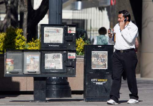 Rick Egan  |  Tribune file photo
Newspaper boxes sit on Main Street in Salt Lake City. Reports say that a prospective buyer has emerged for Utah's largest daily, The Salt Lake Tribune.