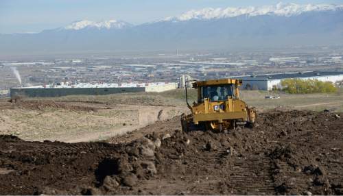 Leah Hogsten  |  The Salt Lake Tribune
Earth movers level the ground around 5400 South and the Mountain View Corridor, Wednesday, April 6, 2016 for the two mile extension project north to 4100 South. Utah Department of Transportation released its list of Top 10 road construction projects statewide for the 2016 construction season