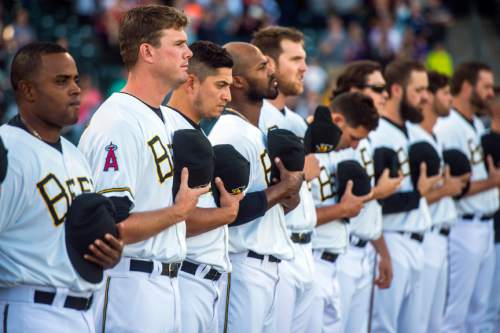 Chris Detrick  |  The Salt Lake Tribune
Members of the Salt Lake Bees stand during the National Anthem during the game at Smith's Ballpark Thursday April 7, 2016.