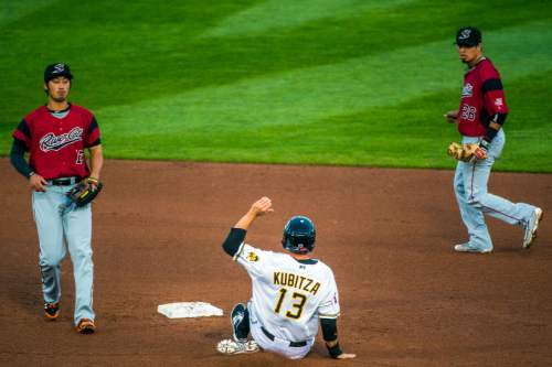 Chris Detrick  |  The Salt Lake Tribune
Salt Lake Bees third baseman Kyle Kubitza (13) steals second base past Sacramento River Cats shortstop Hak-Ju Lee (17) during the game at Smith's Ballpark Thursday April 7, 2016.