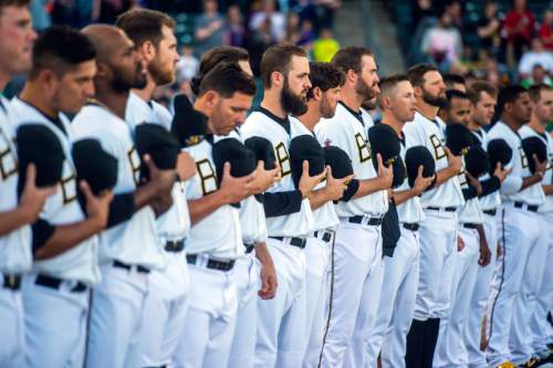 Chris Detrick  |  The Salt Lake Tribune
Members of the Salt Lake Bees stand during the National Anthem during the game at Smith's Ballpark Thursday April 7, 2016.