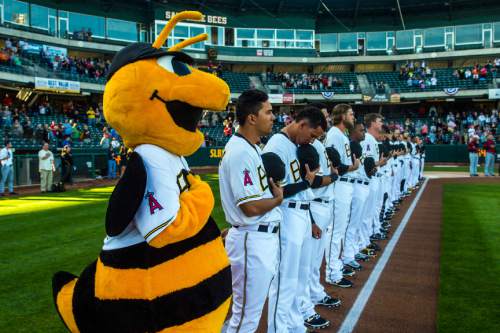 Chris Detrick  |  The Salt Lake Tribune
Members of the Salt Lake Bees stand during the National Anthem during the game at Smith's Ballpark Thursday April 7, 2016.