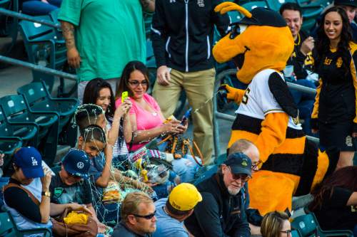 Chris Detrick  |  The Salt Lake Tribune
Bumble sprays kids with silly string during the game at Smith's Ballpark Thursday April 7, 2016.