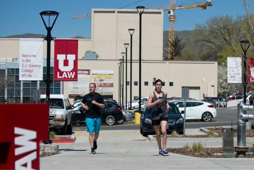 Lennie Mahler  |  The Salt Lake Tribune

University of Utah law students Scott Manning and Brooke Parrish cross the finish line of a mile route around campus Thursday, April 7, 2016. Law students and faculty worked to accumulate a total of 100 miles before law school dean Robert Adler runs a 100-mile course in Zion National Park on Friday. Adler will run the ultra-marathon to push for a 100% bar exam passage rate and 100% employment for law graduates.