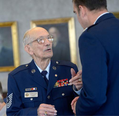 Al Hartmann  |  The Salt Lake Tribune 
Air Force Master Sgt. Ted Kampf, left, has a conversation with Air Force Col. Wade Lawrence from Hill Air Force base  at Utah's annual POW luncheon Friday April 8.  Kampf was a POW in Japan for three years during World War II. The luncheon was organized by the U.S. Department of Veterans Affairs to honor POW's from World War II, Korea, and Vietnam Wars.