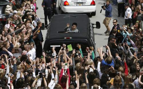 Francisco Kjolseth  |  The Salt Lake Tribune
Surrounded by thousands of screaming fans, David Archuleta leaves The Gateway in Salt Lake City after a brief autograph signing on May 9, 2008.