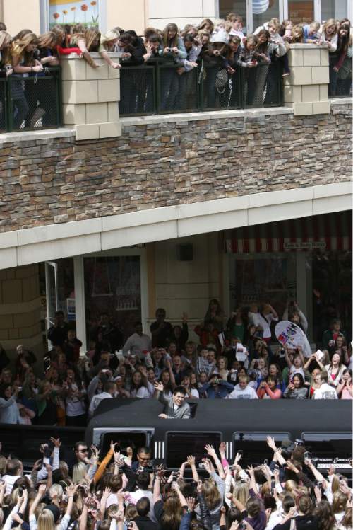 Francisco Kjolseth  |  The Salt Lake Tribune

Surrounded by thousands of screaming fans, David Archuleta leaves The Gateway in Salt Lake City after a brief autograph signing on May 9, 2008.