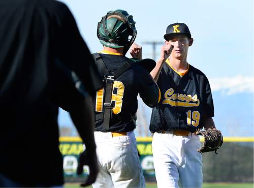 Scott Sommerdorf   |  The Salt Lake Tribune  
Kearns' winning pitcher TJ Haroldsen, right, gets congratulated by his battery mate Dayton Evans after the complete game win over Judge. The Cougars won 12-2 in five innings at Kearns, Friday, April 8, 2016.