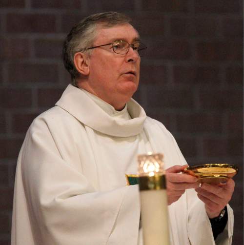 Al Hartmann  |  The Salt Lake Tribune

Monsignor Francis Mannion conducts Mass at St. Vincent de Paul Catholic Church in 2012.