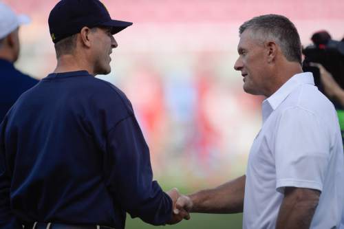 Francisco Kjolseth | The Salt Lake Tribune
Michigan Wolverines coach Jim Harbaugh shakes hands with Utah coach Kyle Whittingham before the start of the game at Rice Eccles Stadium on Thursday, Sept. 3, 2015.