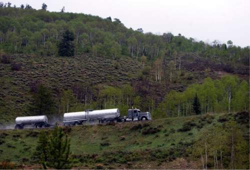 Kim Raff | The Salt Lake Tribune
An oil tanker uses US-40 to travel from the oil fields in the Uintah Basin to the refineries in North Salt Lake near Daniel's Summit in Utah on May 18, 2012.  More tankers are expected to be using US-40 in coming years, increasing wear & tear and creating some safety concerns.