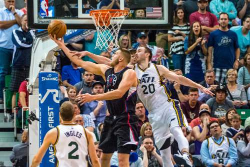 Chris Detrick  |  The Salt Lake Tribune
Los Angeles Clippers center Cole Aldrich (45) shoots past Utah Jazz forward Gordon Hayward (20) during the game at Vivint Smart Home Arena Friday April 8, 2016. Los Angeles Clippers defeated the Utah Jazz 102-99 in overtime.