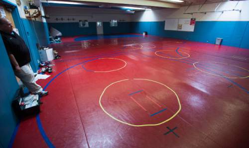 Steve Griffin  |  The Salt Lake Tribune


Ben Lomond High School wrestling room in Ogden, Friday, April 1, 2016. The athletic department is facing significant challenges to become competitive in sports. The Ogden-based school, has witnessed every single program combine for only one region championship in nine years. However, a recent bylaw implemented by the UHSAA granting the freedom to any school with at least 55 percent free and reduced lunch to appeal to move down one classification has given the school hope. Athletics are paramount at the school for many reasons, specifically participation in sports forces students to attend class.