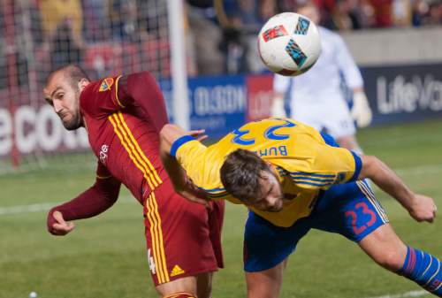 Michael Mangum  |  Special to the Tribune

Colorado Rapids defender Bobby Burling (23) is tied up by Real Salt Lake forward Yura Movsisyan (14) during the second half their match at Rio Tinto Stadium in Sandy, UT on Saturday, April 9, 2016. RSL won 1-0.