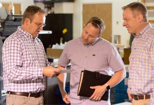 Rick Egan  |  The Salt Lake Tribune

Shane Lyon of Lyon Printing (left) talks with Taylor Morgan and Democratic congressional candidate Doug Owens at his print shop, Thursday, April 7, 2016.