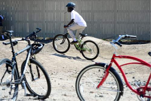 Scott Sommerdorf   |  The Salt Lake Tribune  
Students from Glendale Middle School bicycled over to the 9-Line Pump Track and checked put the bike course there,  and offered their ideas for a future public art installation at the site, Thursday, April 7, 2016.