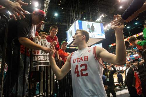 Rick Egan  |  The Salt Lake Tribune

Ute forward Jakob Poeltl (42) high-five's fans as he leaves the court, as Utah defeated USC Trojans 80-72, at the MGM Arena, in Las Vegas, Thursday, March 10, 2016.