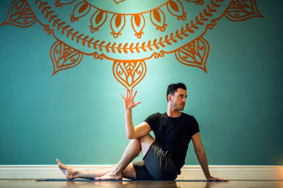 Chris Detrick  |  The Salt Lake Tribune
A.J. Walker does Marichi's pose at Vitalize Studio in Sugar House Saturday March 19, 2016.