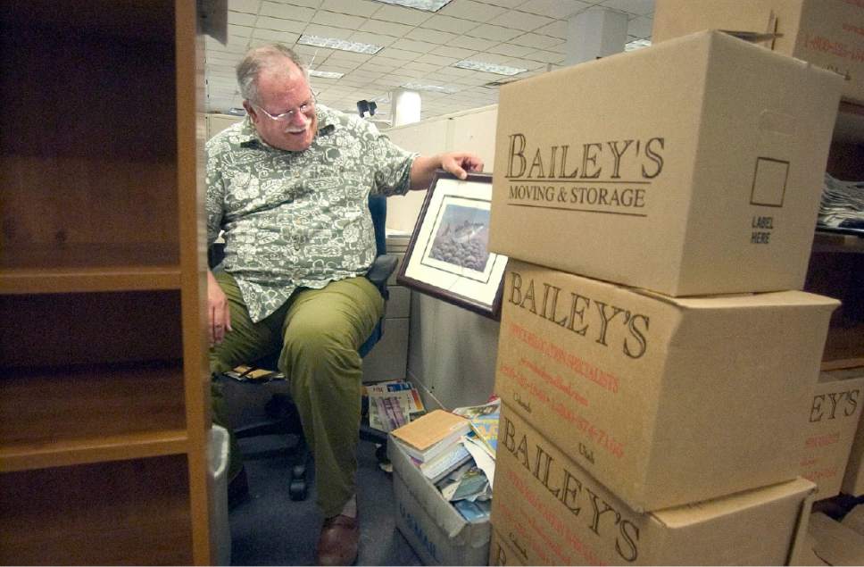 Tribune file photo

Veteran Tribune sportswriter Tom Wharton goes through 30-plus years of accumulated stuff as he, as well as the other less senior members of The Tribune staff, pack up for their move to their new building at The Gateway in 2005.