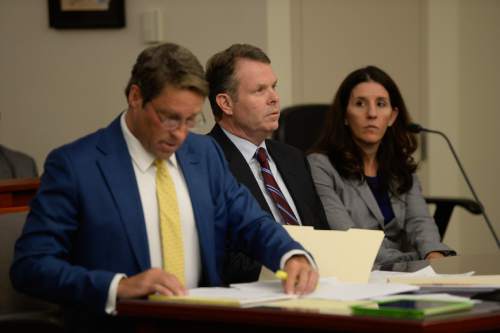 Francisco Kjolseth | The Salt Lake Tribune
John Swallow, center, is joined by defense attorney's Scott C. Williams and Cara Tangaro at the Matheson courthouse on Tuesday, April 12, 2016. Swallow's team was asking the judge to order the Salt Lake County district attorney to seek additional evidence from the FBI.