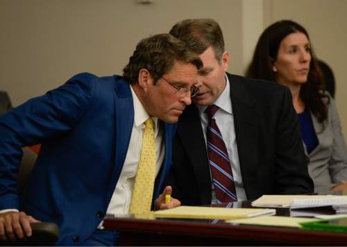 Francisco Kjolseth | The Salt Lake Tribune
John Swallow, center, speaks with his defense attorney Scott C. Williams at the Matheson Courthouse on Tuesday, April 12, 2016. Swallow's team was asking for a preliminary hearing to hear the details of the evidence prosecutors have relied upon in bringing more than a dozen bribery and public-corruption charges against the former Utah attorney general.