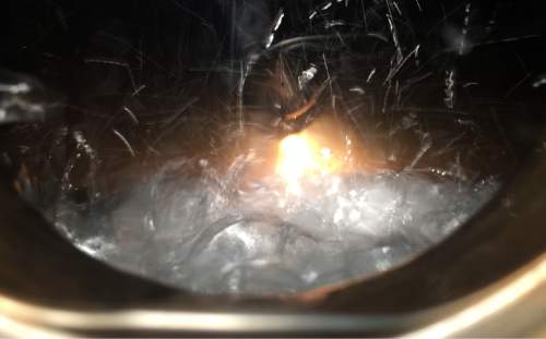 Rick Egan  |  The Salt Lake Tribune

Rum can be seen bubbling in the copper still, at Outlaw Distillery in Midvale. Wednesday, March 23, 2016.