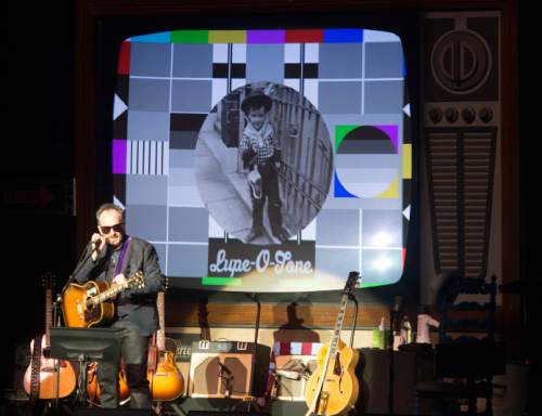 Steve Griffin  |  The Salt Lake Tribune


Elvis Costello performs at Kingsbury Hall in Salt Lake City, Tuesday, April 12, 2016. The 61-year-old English singer-songwriter -- who has endured as a troubadour long past his early days as one of the "angry young men" of the punk and New Wave scenes -- performed a solo show that featured him on piano and guitar, in front of a giant television set that projected "family photos, mysteries, mottos and other mischief." The playlist included old favorites and new songs, with stories along the way.