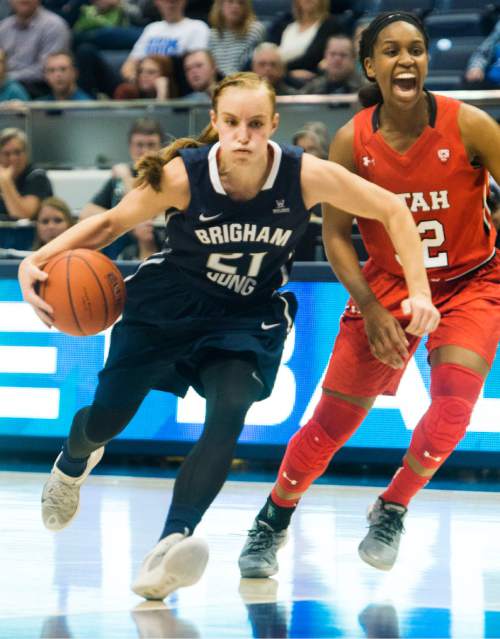 Rick Egan  |  The Salt Lake Tribune

Brigham Young Cougars guard Lexi Eaton Rydalch (21) takes the ball inside, as Utah Utes forward Tanaeya Boclair (32) calls for help, in basketball action, BYU vs. The Univeristy of Utah,  in the Marriott Center, Saturday, December 12, 2015.