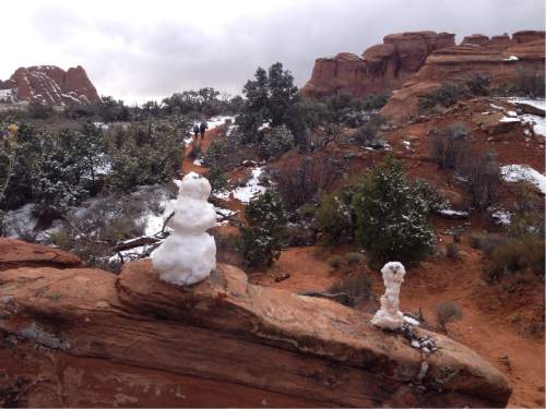 Erin Alberty  |  The Salt Lake Tribune

Snowmen greet hikers on the Broken Arch Loop hike at Arches National Park.